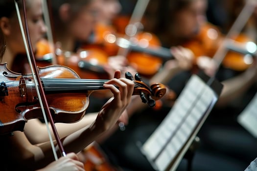 Elegant symphonic orchestra performing classical music concert on stage with professional musicians photo