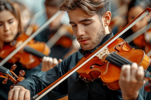 Professional symphonic orchestra performing classical concert with professional musicians on stage photo