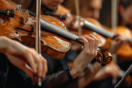 Musicians performing classical music concert with symphonic orchestra on stage photo