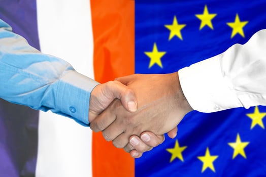 handshake on France and European Union flag background. photo