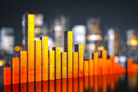 Stacked illuminated bars representing data visualization against a city skyline background photo