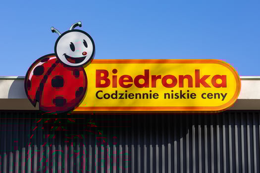 Wroclaw, Poland, January 18, 2025. Close-up view of Biedronka supermarket logo and sign with smiling ladybug mascot in Poland. Polish retail chain, grocery shopping and low everyday prices photo