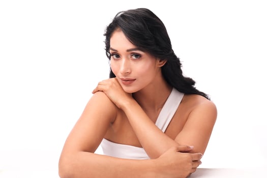 Portrait of A Stylish Woman In A One-Shoulder White Top photo