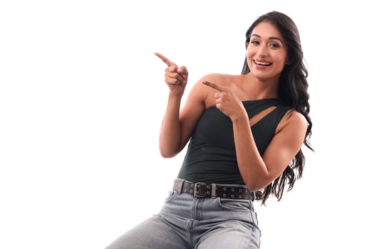 Image of Smiling Woman Pointing Fingers Left photo