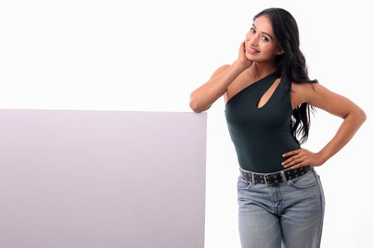 Cheerful Lady Holding Billboard And Looking At Camera photo