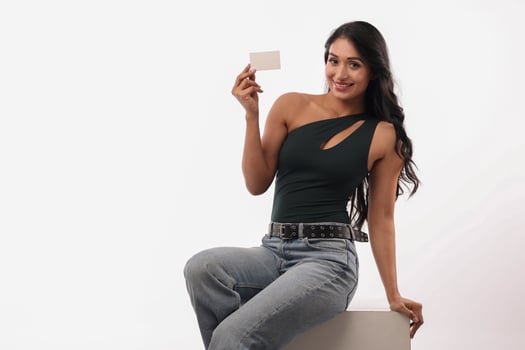 Smiling Female Showing A Card Against A White Background photo
