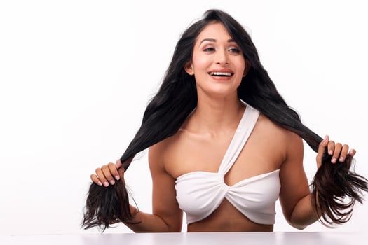 Beautiful Woman Showcasing Long Hair With A Cheerful Smile photo
