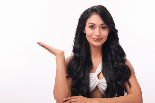 Pretty Girl Holding Copyspace Imaginary On The Palm To Insert An Ad photo