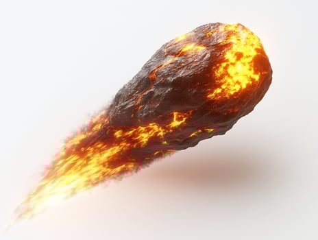 Glowing meteoroid with fiery trail isolated on white background. photo