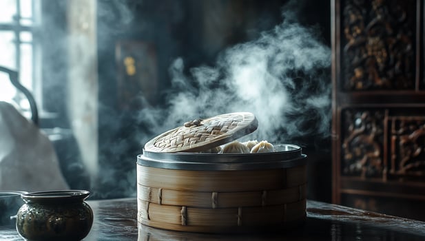 Steaming bao buns in a bamboo steamer on a dark wooden table. photo