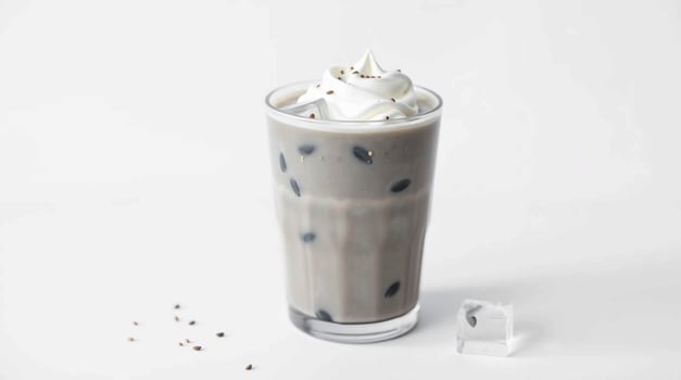 An iced coffee with whipped cream and chocolate chips photo