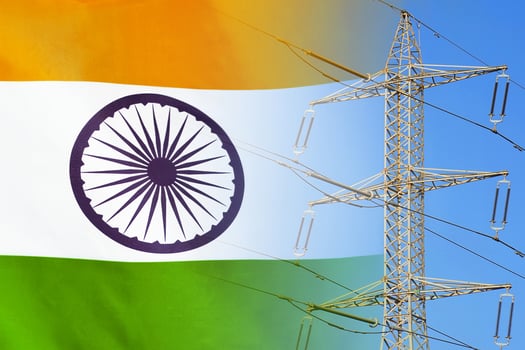 India flag on electric pole background. Increasing energy consumption, energy crisis in India. Price energy are getting more expensive photo