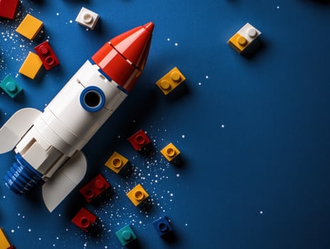 a toy rocket is surrounded by lego bricks photo