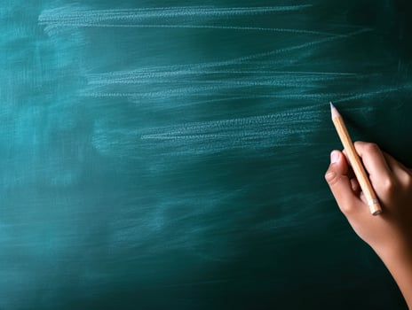 Green Chalkboard with Hand and Pencil, Ready to Write and Learn photo