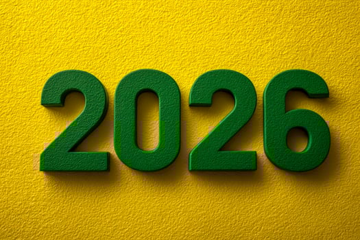Green numbers forming the year 2026 on a textured yellow background photo