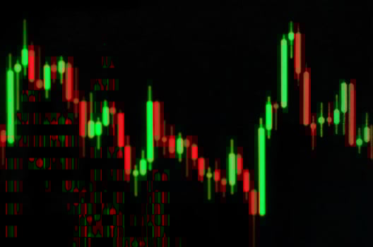 Stock market chart green red candles black background photo