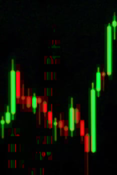 Market chart green red candles black background photo