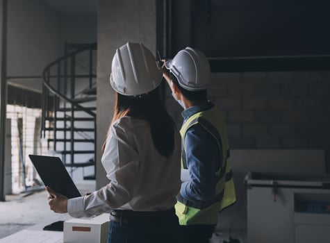 Construction workers discussing a building project photo
