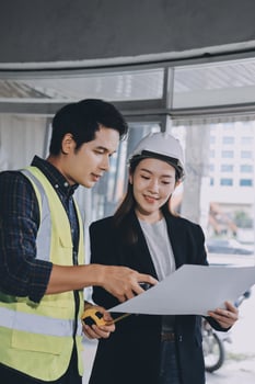 Construction professionals reviewing project documents photo