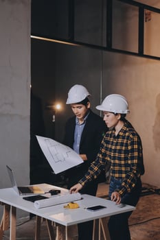 Professionals discussing building plans photo