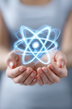 Scientist holding glowing atom model in open hands photo