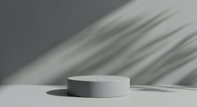 Minimalist stage with soft shadows of leaves cast on a gray wall podium photo