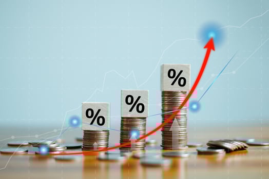 Interest rate and dividend concept, Percentage sign on wooden cubes with stack of coin. income, return, retirement, compensation fund, investment, dividend tax, stock market, loan business, arrow up photo