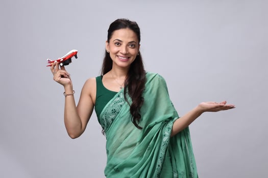 Woman holding airplane model photo