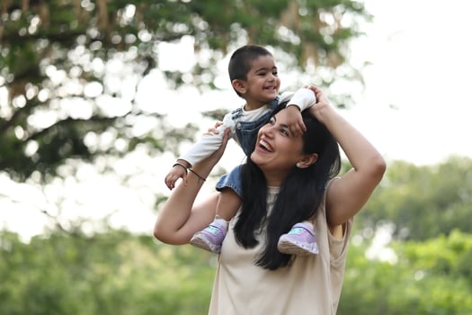 Mother and child smiling outdoors photo