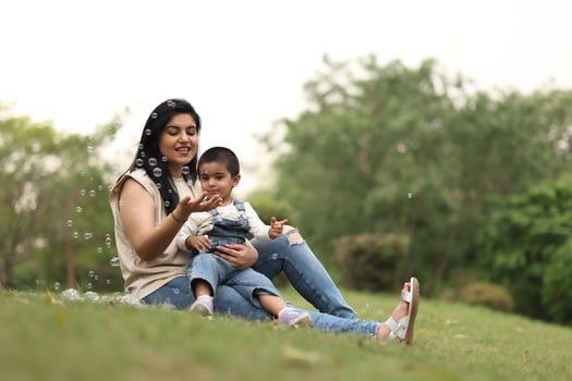 Mother and child playing with bubbles photo