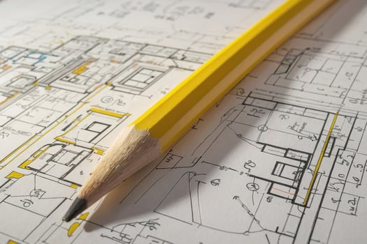 Yellow pencils on a technical drawing project and an architectural plan on the table. The part of architectural project photo