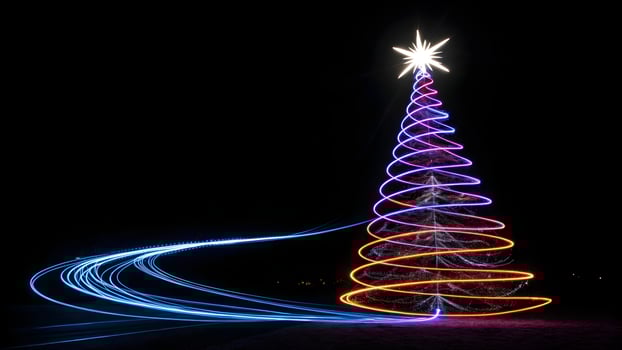 Festive Christmas Tree Illuminated with Neon Spiral Lights and Long Exposure Blue Trails Against a Dark Night Sky, Holiday Celebration photo