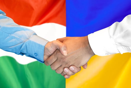 handshake on Hungary and Ukraine flag background. photo