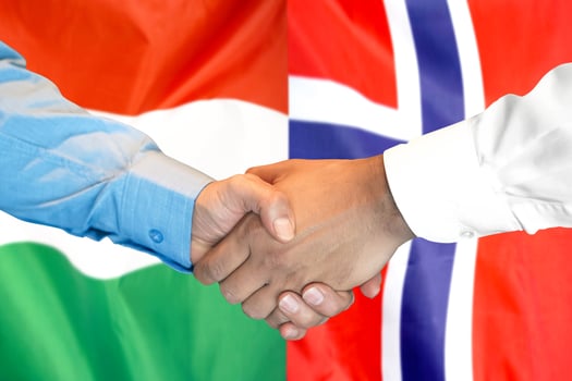 handshake on Hungary and Norway flag background. photo