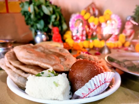 Traditional Indian Prasad Offering with Sweets and Puri photo