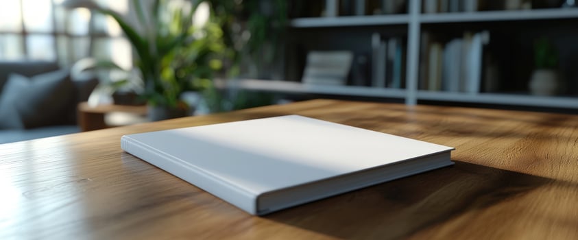 Blank Book Mockup on Wooden Table in Modern Home Office photo
