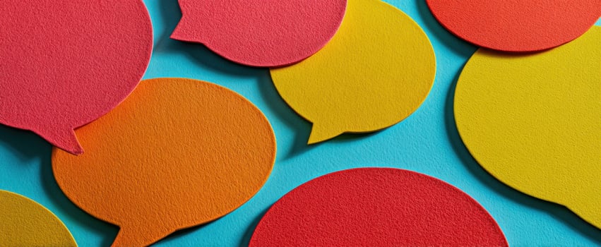 The colorful speech bubbles creating a vibrant communication scene on a blue background. photo