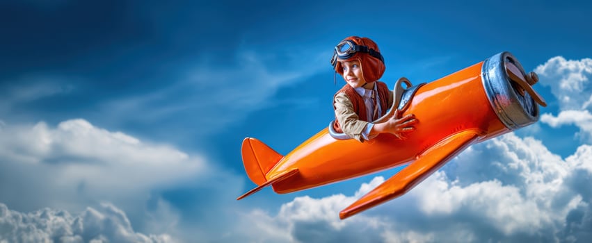 The child soaring through the skies in an imaginative orange airplane. photo