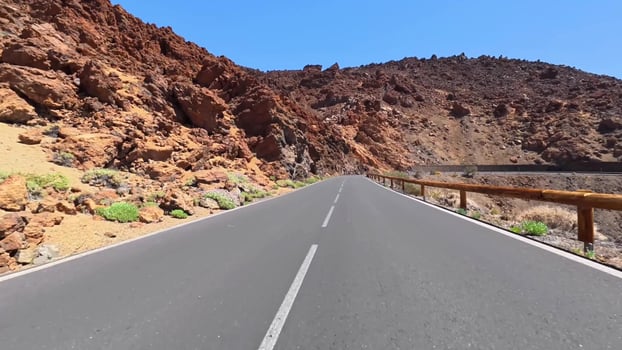 Enjoy a Scenic and Picturesque Mountain Road that Winds through a Majestic Landscape photo