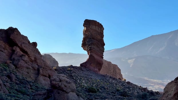 A Unique Rock Formation Surrounded by Stunning Scenic Mountains is truly remarkable photo