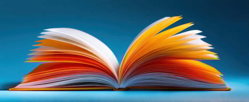 The colorful open book showcasing vibrant pages and textures. photo
