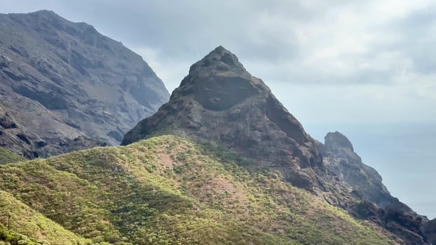 The Majestic Mountain Peak is beautifully surrounded by lush, vibrant greenery and nature photo