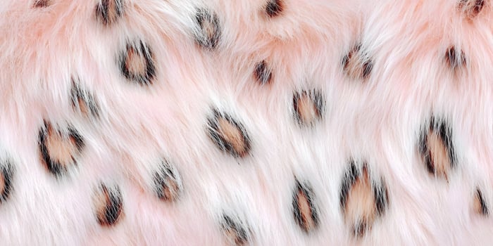 Close up of pink faux fur with brown spots photo