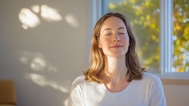 Woman meditates near window, sunlight, calm photo