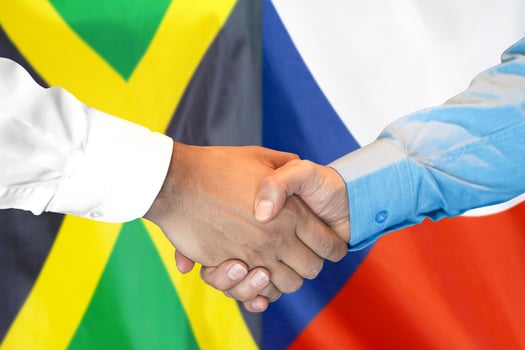 handshake on Jamaica and Czech Republic flag background. photo