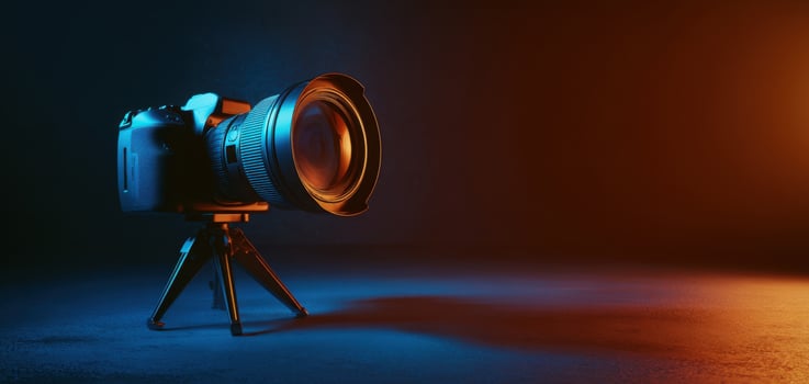 The Camera on a Tripod Bathed in Vibrant Light. photo