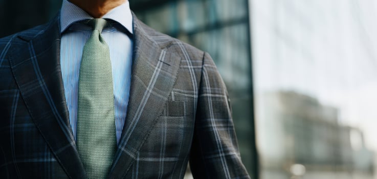 The sophisticated businessman showcasing modern tailored fashion in an urban setting. photo