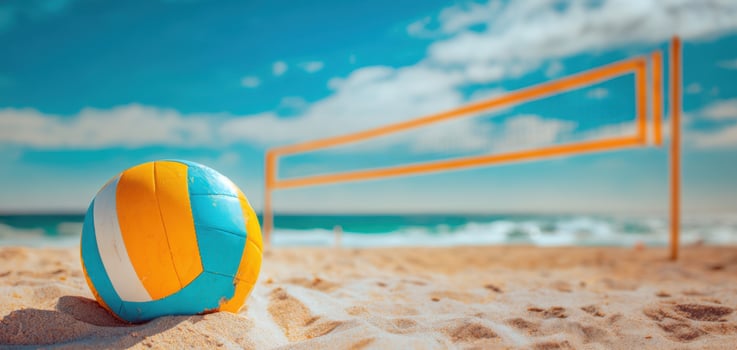 The vibrant beach volleyball ready for play under a sunny sky. photo