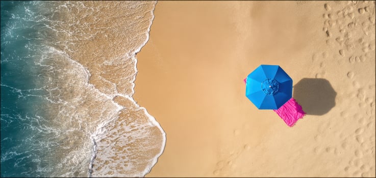 The vibrant blue umbrella on a serene beach with gentle waves. photo