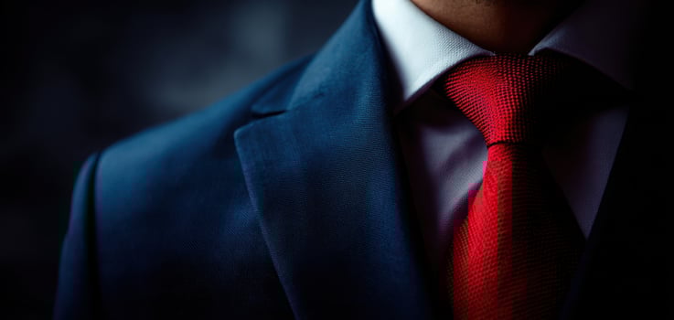 The Elegant Suit and Red Tie of a Professional Man in Close-Up. photo